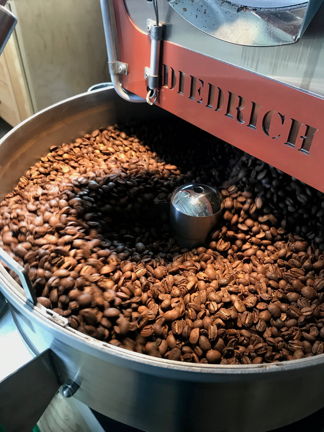 roasted coffee in cooling bin