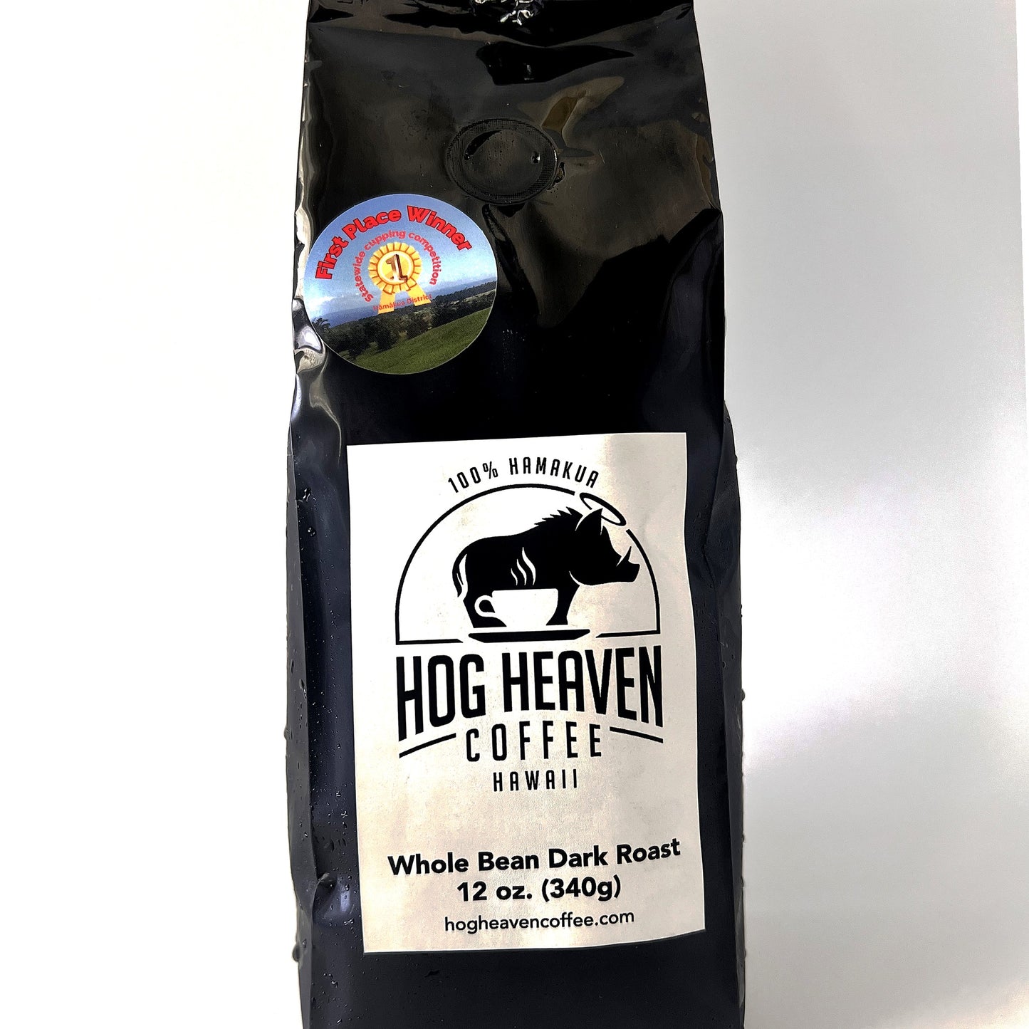 Coffee bag with 'Hog Heaven Coffee Hawaii' 12 oz dark roast label on a white background