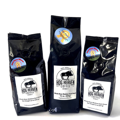 Three medium dark coffee bags with 'Hog Heaven Coffee' labels on a white background